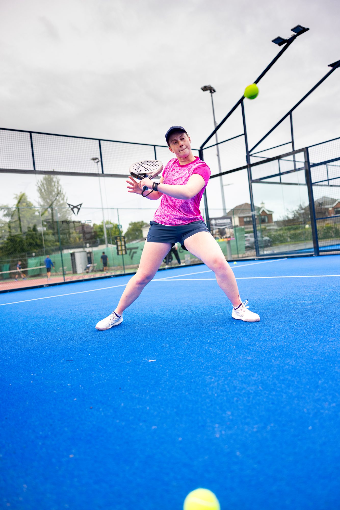 Anna Zuka hitting a forehand on an outdoor padel court